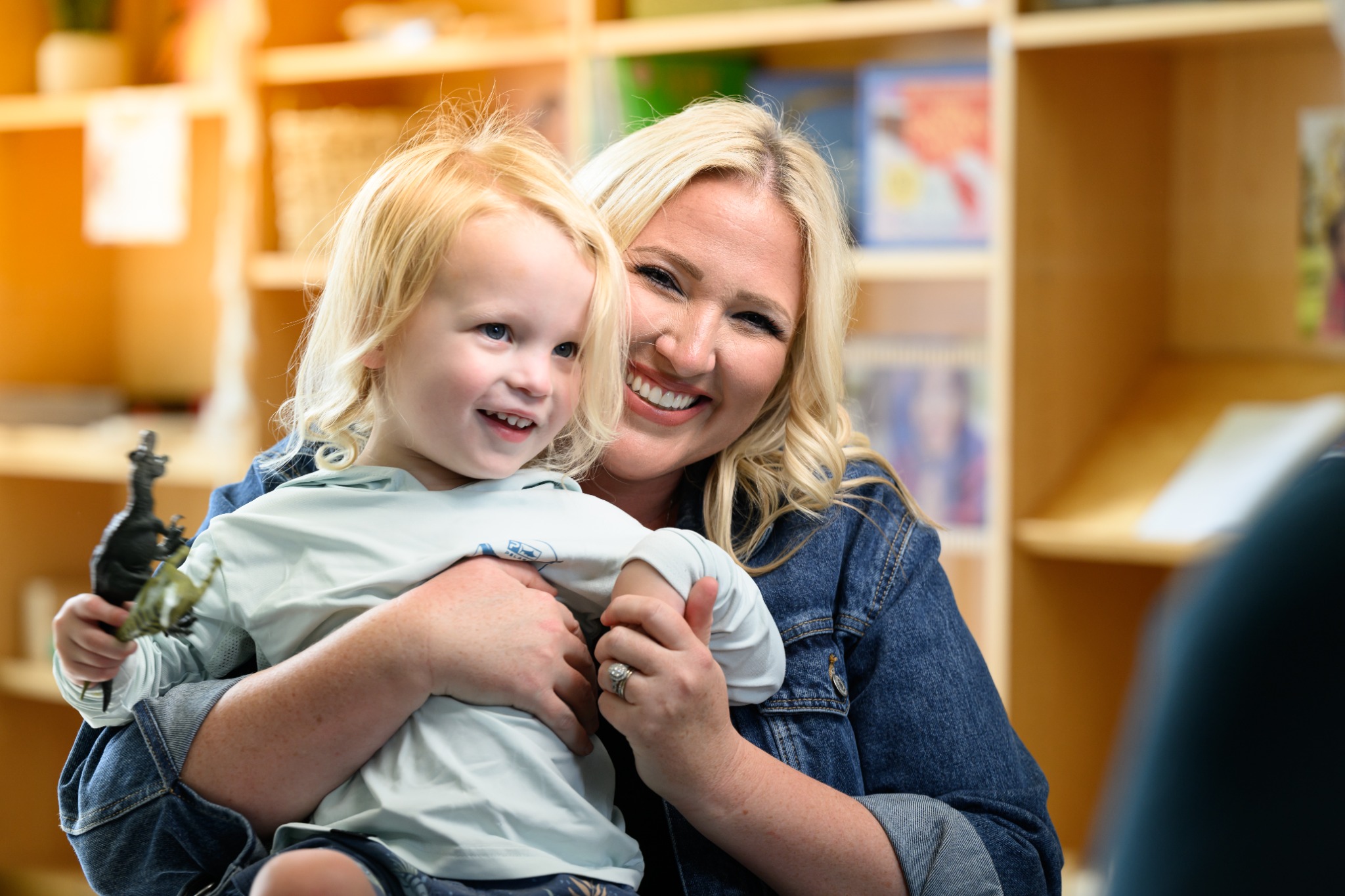A smiling child and caregiver at Easterseals